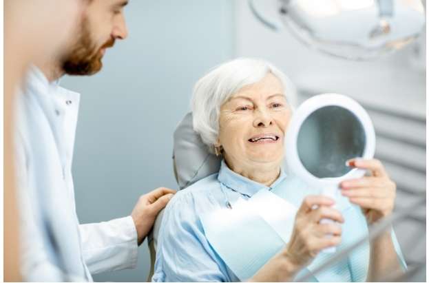 Patient with new dental implants
