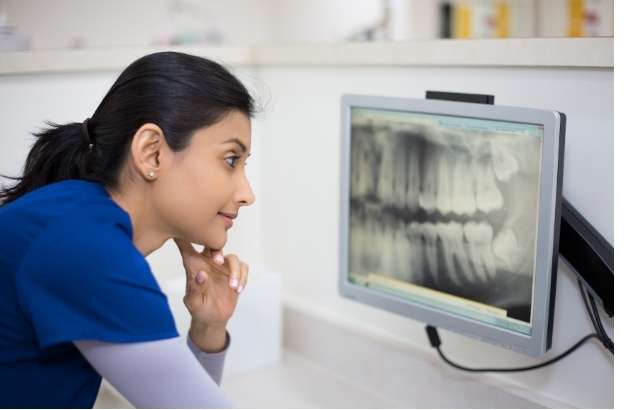 Dentist examining wisdom teeth