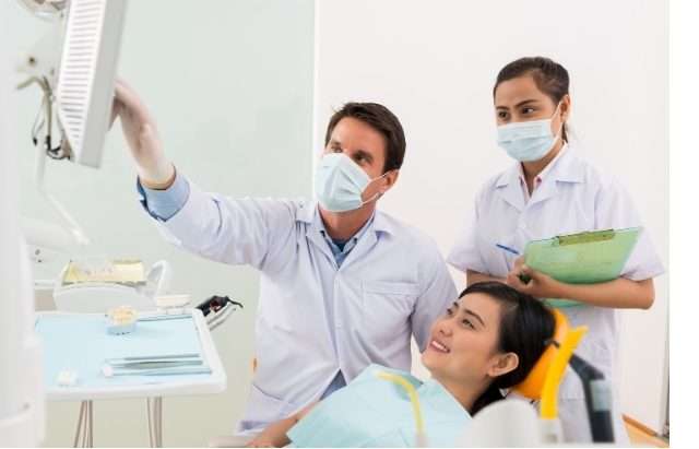 Dentist performing a dental implant procedure