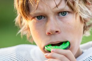 Boy with sports mouthguard